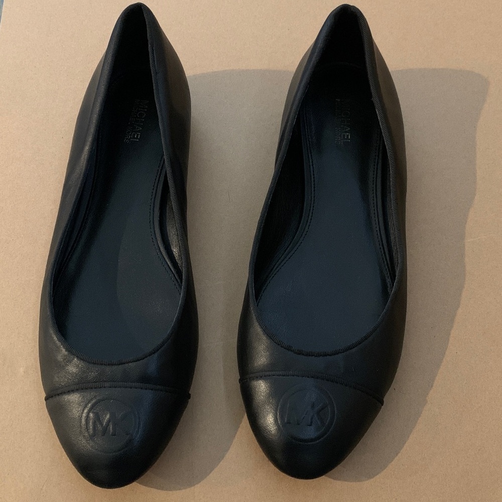 Michael Kors classic ballet flats in black with round cap toe and MK logo